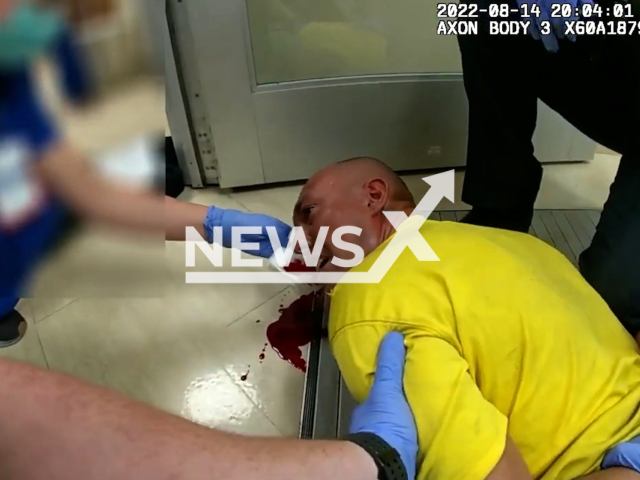 Police officers arrest a man in a use of force incident that occurred last year, in a hospital in Aurora, Colorado, USA, on Aug. 14, 2022. The involved officer was reassigned on Feb. 2 and is currently working in a non-enforcement capacity. Note: Picture is screenshot from a video. (@TheAuroraPolice/Newsflash)