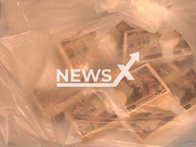 Picture shows 10 million yen (GBP 61542) in cash in garbage bag, undated. The money  was found at a garbage collection facility  in Sapporo Japan, on Jan. 30, 2023. Note: Photo is a screenshot from a video. (Newsflash)