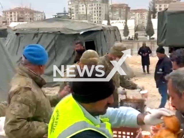 Emergency services provide earthquake victims with hot meals, in Malatya, Turkey, in undated footage. Thousands of people have been left injured as a result of the earthquake. Note: Picture is screenshot from a video. (@TCMilliSavunmaBakanligi/Newsflash)