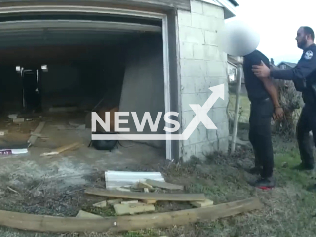 Police officer arrests a suspect in Louisville, Kentucky, on Monday, Feb. 20, 2023. The suspect was involved in the officer-involved shooting that occurred at  800 block of S. 38th St. in Louisville. Note: Picture is a screenshot from a video (@LouisvilleMetroPD/Newsflash)