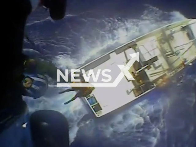 Coast Guard Air Station New Orleans MH-60 Jayhawk helicopter aircrew hoists crewmember from a fishing vessel during a medevac operation near Pensacola, Florida, on Monday, Mar. 6, 2023.  Coast Guard Watchstanders had received a report of a 70-foot fishing vessel Kim Nhi that was requesting a medevac. Note: Picture is screenshot from a video. (Air Station New Orleans; U.S. Coast Guard/Newsflash)