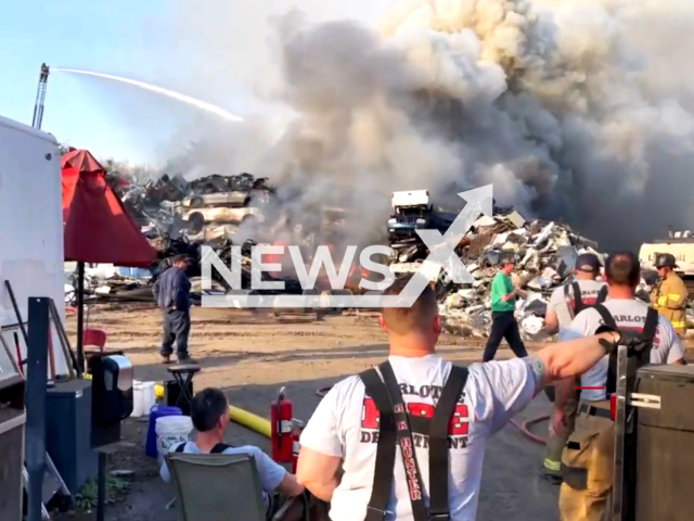 Picture shows the scene of the fire at a scrap metal recycling facility, in Charlotte, North Carolina, in undated footage. Charlotte Fire controlled the incident in less than 2 and a half hours. Note: Picture is a screenshot from a video. (@CharlotteFireDept/Newsflash)