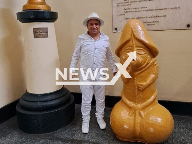 Mayor Arturo Fernandez Bazan, poses with the statue  in Trujillo, Peru, undated. He placed a statue in the shape of a penis in the city hall. Note: Private photo.  (Newsflash)