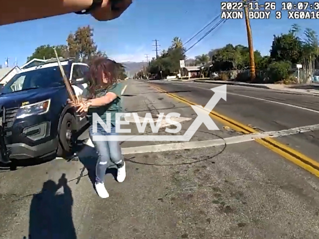 Police shoot a woman with a wrench after she attacked a car in Los Angeles, USA on Nov. 26, 2023. Blaney sustained gunshot wounds and was transported to a local hospital for treatment. Note: Picture is a screenshot from a video. (Los Angeles County Sheriff's Department/Newsflash)