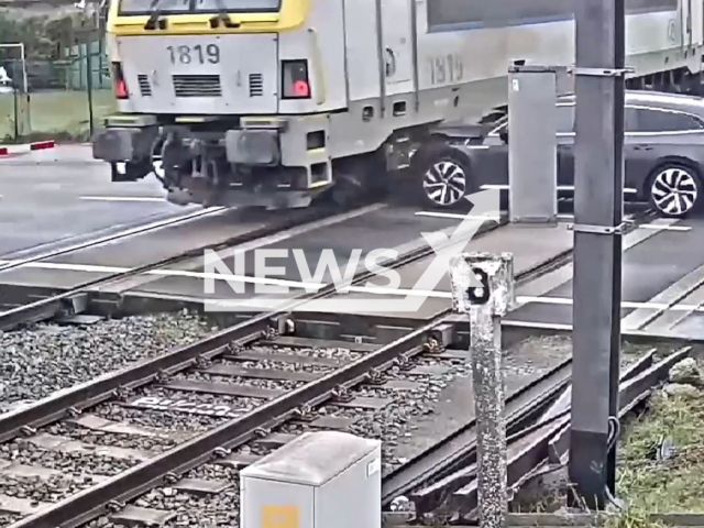 A vehicle collides with a train at a railway crossing on Edingsesteenweg in Herne, Belgium, on Thursday, March 9, 2023. The driver got out of his vehicle just in time and survived the incident without any injury. Note: Picture is screenshot from a video. (Newsflash)