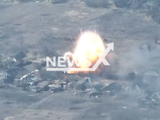 Russian T-80U tank explodes in a residential area in Ukraine in undated footage. The footage was released by the 1st Severia Tank Brigade of the Ukrainian Ground Forces on Monday, Mar. 13, 2023. Note: Picture is a screenshot from a video (@1ogtb/Newsflash)