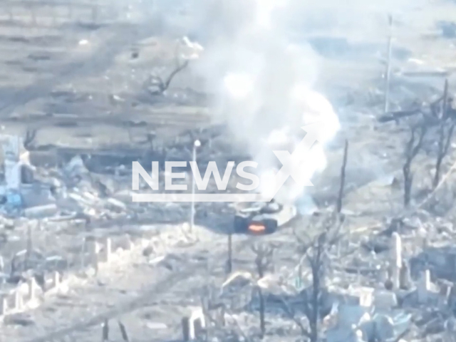 Russian tank explodes in a residential area of Ukraine in undated footage. The footage was released by the 79th Brigade of the Ukrainian Air Assault Forces on Wednesday, Mar. 15, 2023. Note: Picture is a screenshot from a video (@79AMBUA/Newsflash)