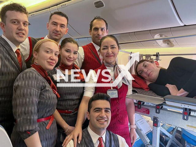 Photo shows Rumeysa Gelgi with the flight crew during her flight from San Francisco, USA, to Istanbul, Turkey, Tuesday, March 14, 2023. Rumeysa Gelgi is a Turkish advocate, researcher, and front-end developer, who holds the title of the tallest living woman. Note: Picture is private (@rumeysagelgi/Newsflash)