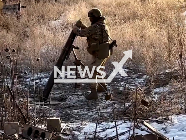 Ukrainian soldier loads rocket to mortar in the Zaporizhzhia direction, Ukraine in undated footage. The footage was released by the the Command of the Ukrainian Special Operations Forces on Wednesday, Mar. 15, 2023. Note: Picture is screenshot from a video. (@usofcom/Newsflash)