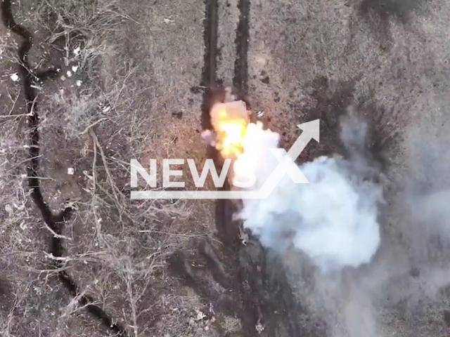 Russian tank explodes in a field area in Ukraine in undated footage. The footage was released by the 59th brigade of the Ukrainian Ground Forces on Wednesday, Mar. 15, 2023. Note: Picture is screenshot from a video. (@59ompbr/Newsflash)