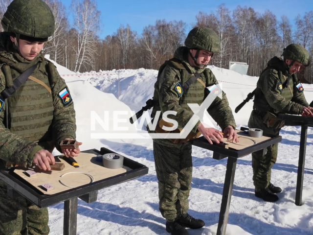 Russian recruits train to make mines for blowing up enemies in future in Koltsovo, Novosibirsk Oblast, Russia in undated footage. The footage was released by the Russian Ministry of Defense on Wednesday, Mar. 15, 2023.  Note: Picture is a screenshot from a video (@function.mil.ru/Newsflash)