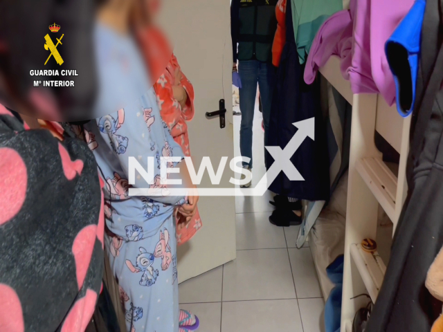 Police frees the women, in Zorroza, Spain, undated. The women were locked in an apartment forced to take drugs and work as prostitutes. 
Note: Police photo. (Newsflash)