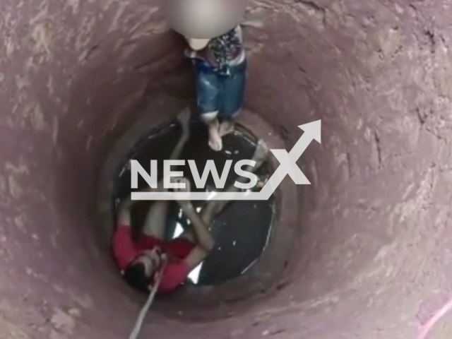 Firemen rescue kid who fell in a cistern in Porangatu, Goiás state, Brazil, Saturday, Mar. 11, 2023. According to a family member, the children were playing on top of the cistern cover when it collapse. Note: Picture is a screenshot from a video (@cbmgo/Newsflash)