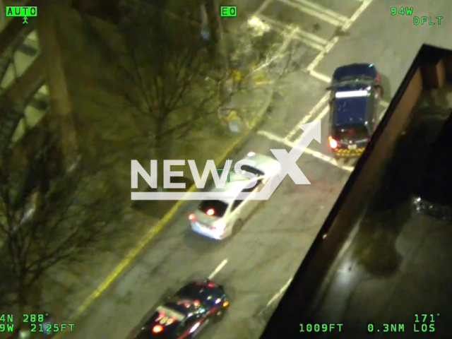 Atlanta Police officers identify a stolen vehicle driving in downtown Atlanta, Georgia, USA on March 3, 2023. All occupants were found wearing gloves, and authorities discovered various tools used for breaking into vehicles inside the car. Note: Picture is a screenshot from the video. (Atlanta Police Department/Newsflash)