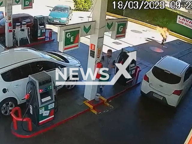 A  customer running on fire in Curitiba, Brazil, on Saturday, March 18, 2023. A gas station attendant   threw gasoline on him and set him on fire  after he  complained that  his car key was damaged by the worker. Note: Picture is screenshot from a video. (Newsflash)