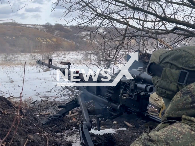 Russian paratroopers fire from machine guns at the Ukrainian advancing forces in Ukraine in undated footage. The footage was released by the Russian MoD on Monday, Mar. 20, 2023. Note: Picture is screenshot from a video. (Ministry of Defense of Russia/Newsflash)