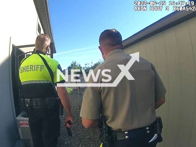 Police officer arriving on scene in Ada County, Idaho, USA, undated. After leaving the property, an officer raised his weapon as the suspect appeared to readjust his own gun, leading to the tragic shooting. Note: The picture is  a screenshot from the video. ( Ada County Sheriff's Office/Newsflash)