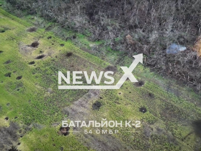 Ukrainian combat drone destroys Russian soldier who was trying to hide in the bushes in Ukraine in undated footage. The footage was released by the K2 group of the 54th OMBr on Tuesday, Mar. 21, 2023. Note: Picture is a screenshot from a video (@K2.54OMBr/Newsflash)