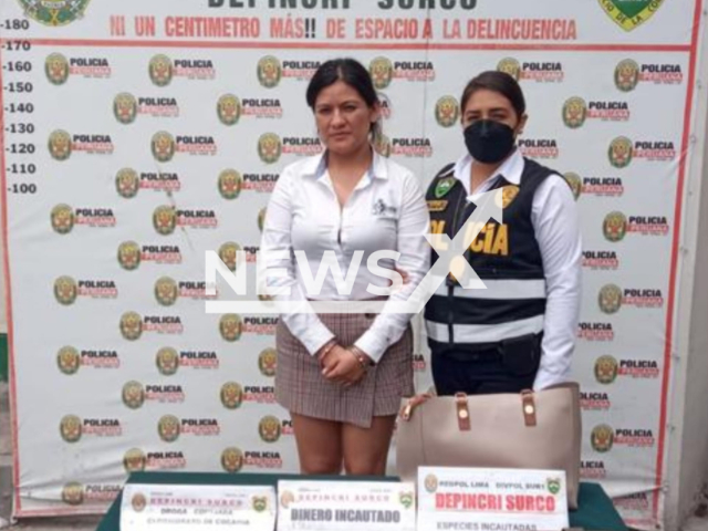 Alexandra Dayanara Ore Morales, 28, pictured with police officer, known as 'The Black Widow' , was arrested accused of  scamming a 50-year-old businessman and stealing his residence, in March, Chile.
 
Note: Private photo.  (Newsflash)