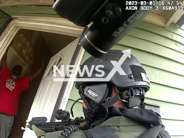 Police officers arrest one of the suspects during a  drug raid in Atlanta, Georgia, USA on March 1, 2023. The operation led to the recovery of 1,867.5 grams of cocaine, 432.8 grams of methamphetamine, 427.1 grams of fentanyl, 87.4 grams of marijuana, 40 grams of heroin, 11.3 grams of ecstasy pills, three firearms, and $1,880 in cash. Note: Picture is screenshot from a video. (@Atlanta_Police/Newsflash)