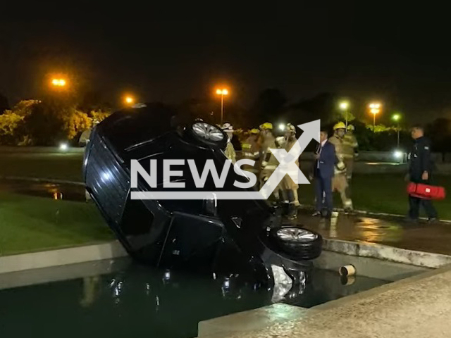 Picture shows the vehicle that fell into the reflecting pool at the entrance to the Planalto Palace in Brasili, Brazil, on Tuesday, March 21, 2023. The driver of federal deputy Marcos Tavares was driving alone when he got confused with the track and the reflection of the water.
 Note: Photo is a screenshot from a video. (Newsflash)