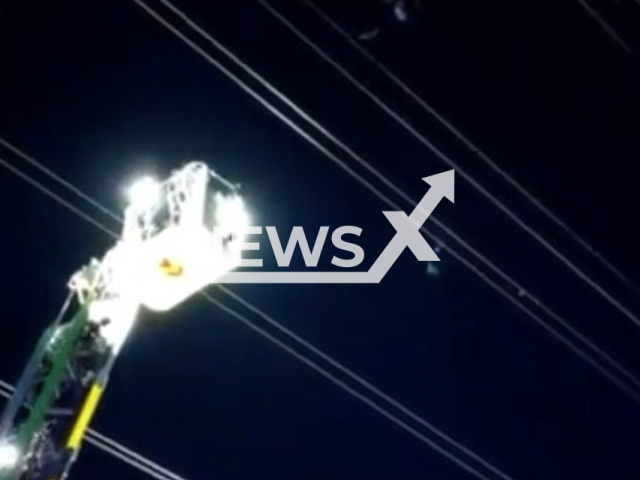 Firefighters rescue a paraglider, in Nuevo Baztan, in Madrid, Spain, in undated footage. The paraglider was hooked on some high voltage cables 25 meters high. Note: Picture is a screenshot from a video (Security and Emergency Agency Madrid 112/Newsflash)