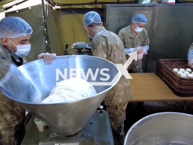 TAF Humanitarian Aid Brigade cooks food for citizens in Hatay, Turkey, in undated footage. Thousands of people have been left homeless as a result of the earthquake and now live in tents. Note: Picture is screenshot from a video. (@tcsavunma/Newsflash)