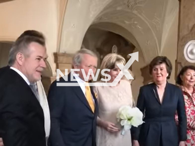 Picture shows Wolfgang Porsche, 79, (second from left) and his wife  Claudia Porsche , 74,  (third from right) with guests at their wedding in 2019. He has filed for divorce from his wife because of a dementia-like illness that has existed for two years and has led to a change in Claudia Porsche's personality.
 Note: Photo is a screenshot from a video. (Newsflash)