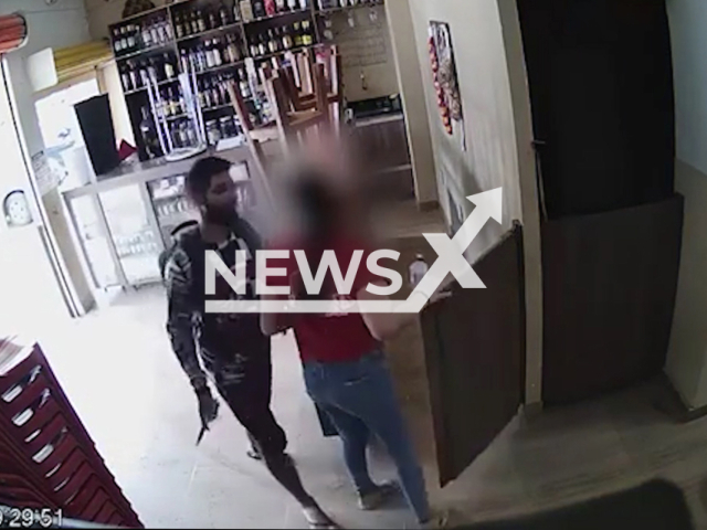 A man attacks  his ex with a knife at her work, in Vicente Pires, Brazil, on Thursday, March 23, 2023. The victim is hospitalized in a very serious condition, suspect was detained by the public until the police arrived. Note: Picture is screenshot from a video. (Newsflash)