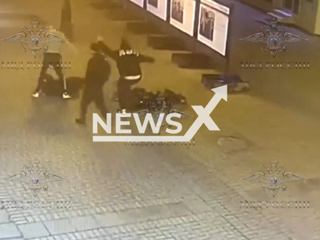 Burglars violently attack victims on Arbat Street, in Moscow, Russia, in undated footage. The authorities detained two young people and a girl. Note: Picture is screenshot from a video. (@mvdros/Newsflash)