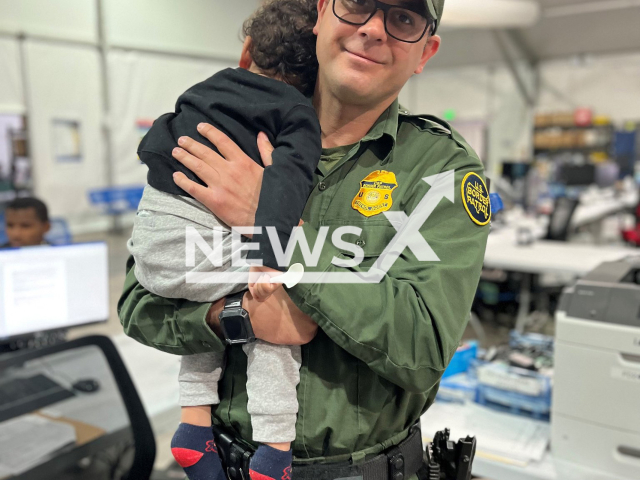 Photo shows a one-year-old baby who was abandoned on the International line next to the bed of the Colorado River, in the Yuma sector between Sonora, Mexico and Arizona, USA, with an agent from the U. S. Border Patrol. The baby was rescued by an agent of the U. S. Border Patrol. Note: Photo is from the Chief of the U.S Border Patrol (@USBPChief/Newsflash)