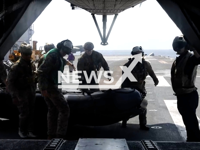 U.S. Marines with the Maritime Raid Force, 31st Marine Expeditionary Unit, conduct helocast training at Kin Blue training area, Okinawa, Japan, on Monday, Mar. 6, 2023. Helocasting is an insertion method used by small teams to execute maritime operations. Note: Picture is screenshot from a video. (Marcos Alvarado; U.S. Marine Corps/Newsflash)