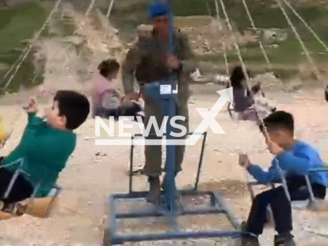 Soldiers play with children, earthquake victims, in Malatya, Turkey, in undated footage. Thousands of people have been left homeless as a result of the earthquake. Note: Picture is a screenshot from a video (@tcsavunma/Newsflash)