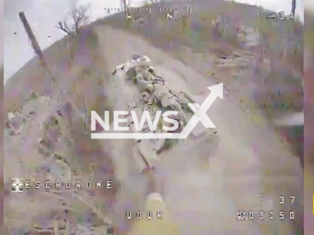 Ukrainian Special Forces kamikaze drone destroys Russian armored personnel carrier with infantry in Ukraine in undated footage. The footage was released by the Security Service of Ukraine on Monday, Mar. 27, 2023. Note: Picture is a screenshot from a video (@SecurSerUkraine/Newsflash)