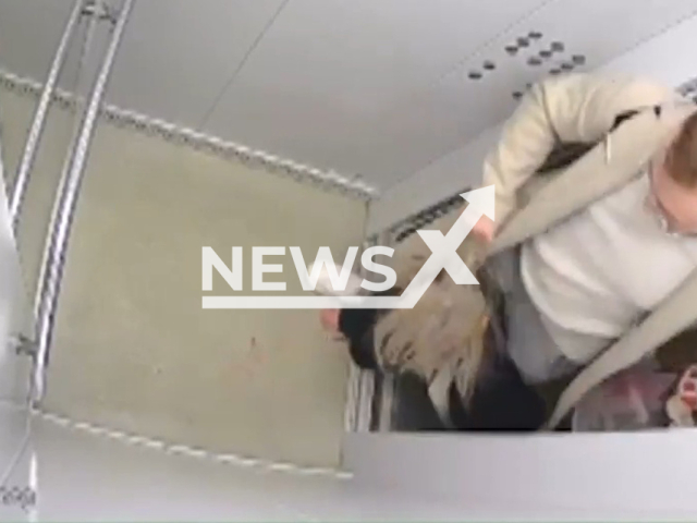 A man hits his wife and pulls her by the hair in Ufa, Bashkortostan, Russia, undated. At one point, he is seen poring coffee on his wife's head. Note: Picture is a screenshot from a video (Newsflash)