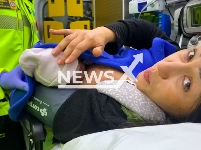 Laura, 38, and Zaira, her second daughter born on the street before the mother can go to the hospital, in Madrid, Spain, on 23rd March. Note: This picture is a screenshot from the video (@EmergenciasMad/Newsflash).