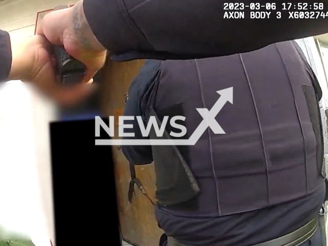 Police officer points with a gun while entering on the scene in Phoenix, Arizona, USA on March 6, 2023.  An internal investigation is ongoing, with conclusions regarding the officer's actions to be determined once all facts are known and the investigation is complete. Note: Picture is a screenshot from the video. (PhoenixPolice/Newsflash)