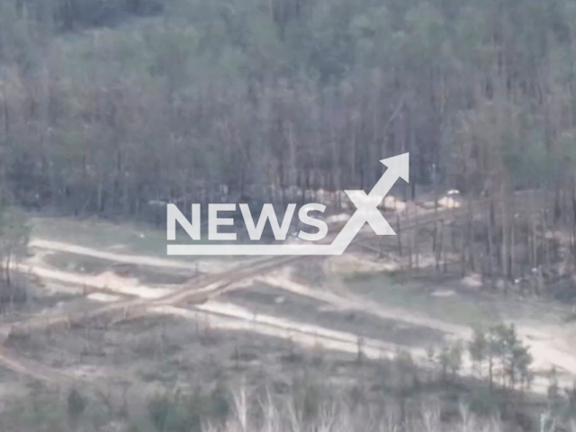 The mortars of the National Guard of Ukraine hit Russian military position near the forest in Ukraine in undated footage. The footage was released by the National Guard of Ukraine on Wednesday, Mar. 29, 2023. Note: Picture is a screenshot from a video (@ng_ukraine/Newsflash)