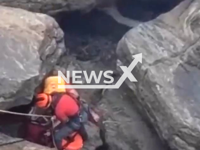 Rescuers rescue a father and daughter who fell into the sea after their jet ski capsized in Guaruja, Brazil on March 27, 2023.Note: Picture is screenshot from a video. (@PMESP/Newsflash)