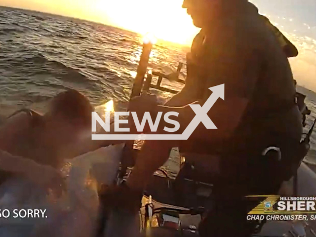 Officers rescue the boy after falling off a jet ski near Fantasy Island in Tampa, Florida, USA on March 25, 2023. The Marine Unit safely transported the teenager back to Davis Islands. Note: Picture is a screenshot from the video. (HCSOSheriff/Newsflash)