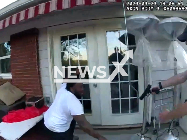 A police officer arrest the suspect after a high-speed chase in Atlanta, Georgia, USA on March 23, 2023. The suspect, identified as 30-year-old Cepeda Carter, was charged with multiple traffic violations and obstruction, in addition to his outstanding warrant for aggravated assault. Note: Picture is screenshot from a video. (Atlanta Police Department/Newsflash)