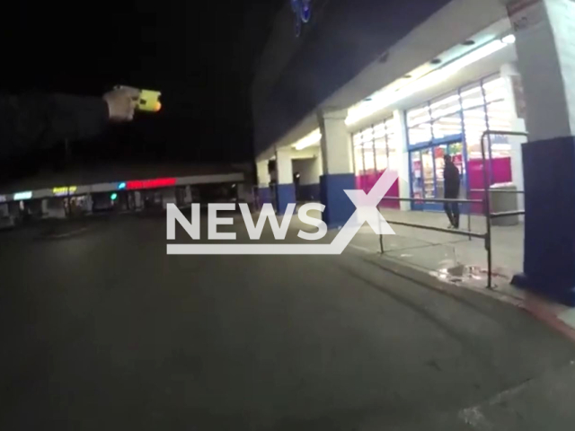 Police officer pointing a gun at the suspect in Bakersfield, California, USA on March 18, 2023. The officer who fired the shots was placed on paid administrative leave, which is standard procedure following a shooting. Note: Picture is screenshot from a video. (Bakersfield Police Department BPD/Newsflash)