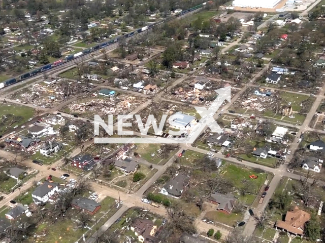 The picture shows the view from a Blackhawk helicopter observing the damage and overseeing the progress of Arkansas National Guard operations on the ground in Arkansas, USA on April 1, 2023. The Arkansas National Guard is continuing its efforts to assist in the recovery and cleanup process. Note: This picture is a screenshot from the video. (@DVIDSHub/Newsflash)