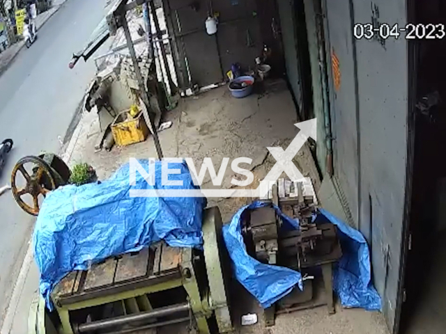 A 13-year-old girl is dragged on the street holding on to the motorbike of a thief who stole her mothers' mobile phone in Ho Chi Minh City, Vietnam, on Monday, April 3, 2023. Dinh Hoang Nam, 48, stole a stall's owner phone and her daughter tried to stop him.    Note: Picture is screenshot from a video. (Newsflash)