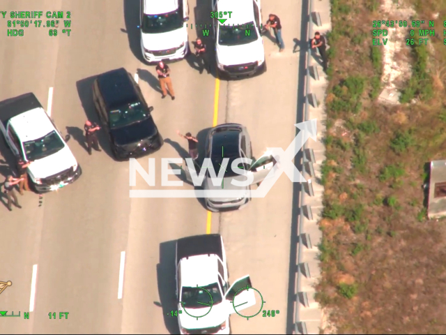 Police officers arrest the suspect  Robert Lynch IV in Lee County, Florida, USA on April 3, 2023. Multiple units from the Lee County Sheriff's Office were involved in Lynch's arrest, which took place during a traffic stop on Interstate-75. Note: Picture is a screenshot from the video. (Lee Sheriff/Newsflash)