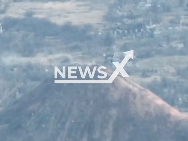 Ukrainian kamikaze drone destroys the Russian military observation point in the Donetsk region in Ukraine in undated footage. The footage was released by the 35th separate marine infantry brigade on Sunday, Apr. 9, 2023. Note: Picture is screenshot from a video. (@35obrmp/Newsflash)