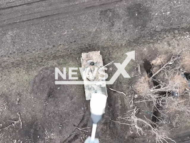 Ukrainian drone drops bomb on the Russian infantry fighting vehicle near Vuhledar in Ukraine in undated footage. The footage was released by the 72nd of the separate mechanized brigade on Sunday, Apr. 9, 2023. Note: Picture is screenshot from a video. (@72.brigade.best/Newsflash)