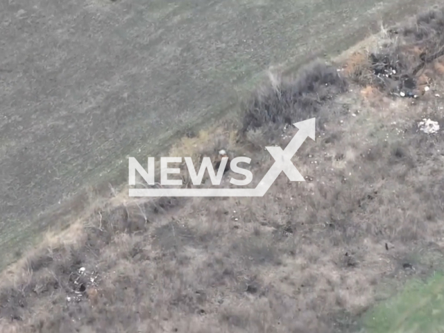 Ukrainian fighters hit and destroy Russian electronic warfare (EW) system called "Strizh" by self-propelled artillery "Crab" in Ukraine in undated footage. The footage was released by the 30th separate mechanized brigade on Tuesday, Apr. 11, 2023. Note: Picture is a screenshot from a video (@30brigade/Newsflash)