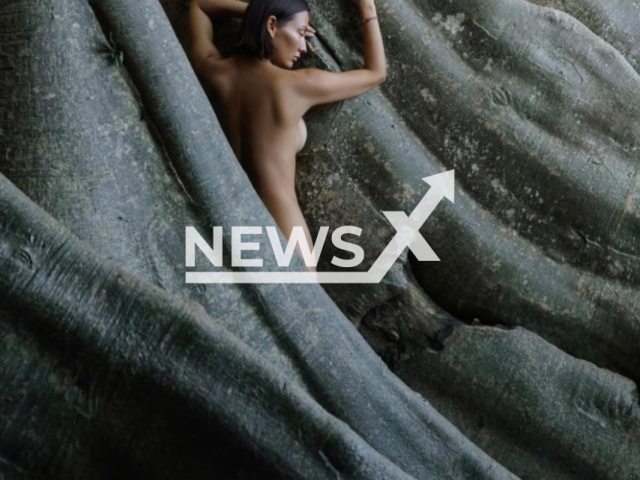 Picture shows Russian tourist    Luiza Kosykh posing naked   on a 700-year-old sacred tree in Tabanan, Bali, undated. Social media activist Ni Luh Putu Ary  Djelantik  shared  the images on social media where netizens criticised the woman. 
 Note: Photo is a screenshot from a post. (Newsflash)