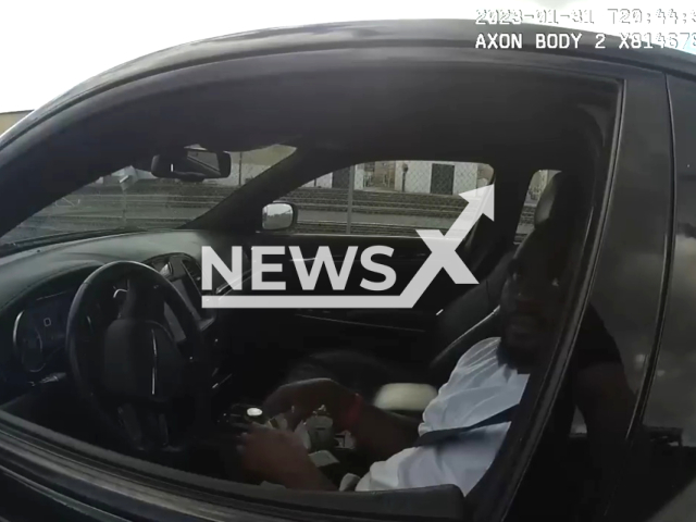 Police officer talks with Breion Brown in a traffic stop in Jacksonville, Florida, on Jan. 31, 2023. Brown claimed the officer had choked him with his vehicle's seat belt, however, body camera footage showed his allegations were false. Note: Picture is a screenshot from a video (@JAXSHERIFF/Newsflash)